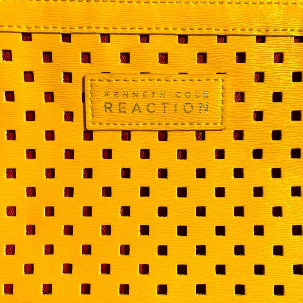 Yellow and pink Kenneth Cole Reaction wristlet!